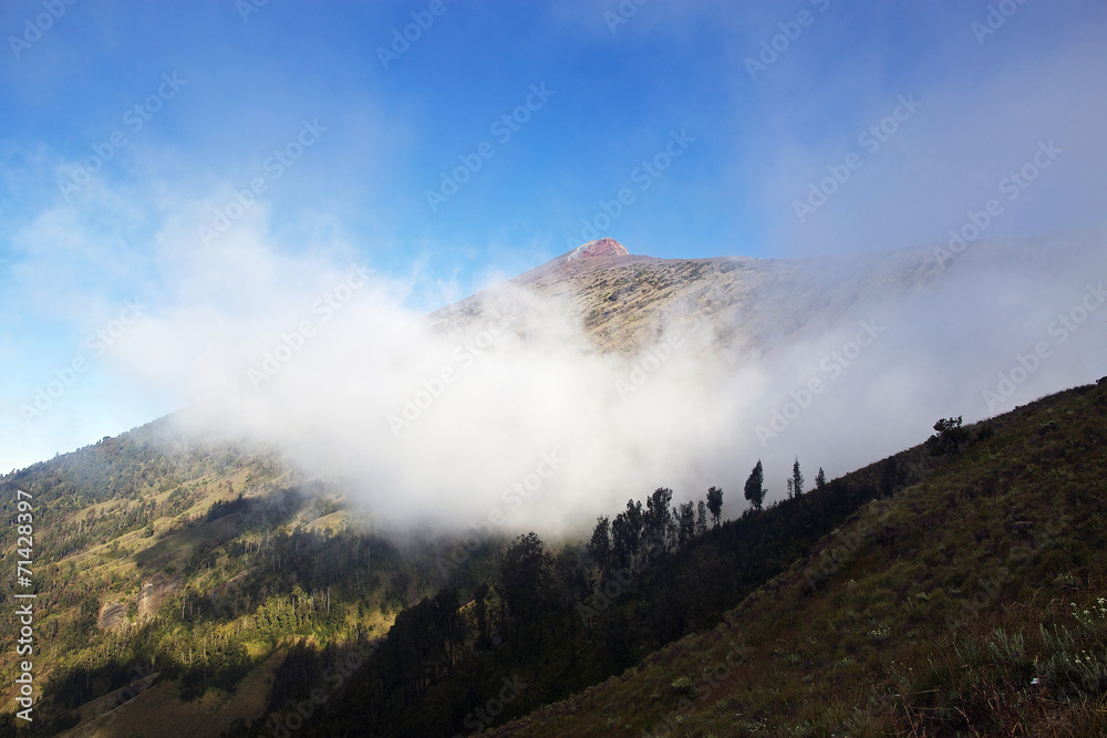 Volcano Rinjani in cloud with summit path