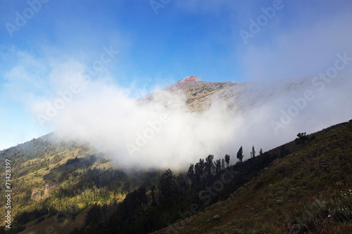 Volcano Rinjani in cloud with summit path