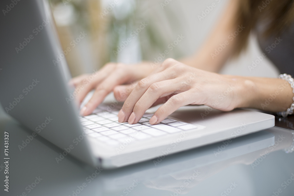 Young woman working on a laptop Young woman working on a laptop