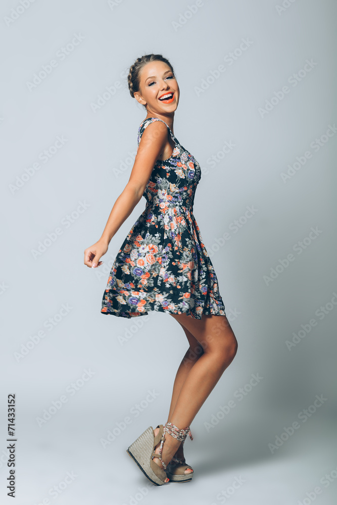 Beautiful sexy young woman dancing