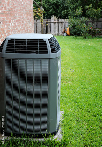 Modern air conditioner on backyard