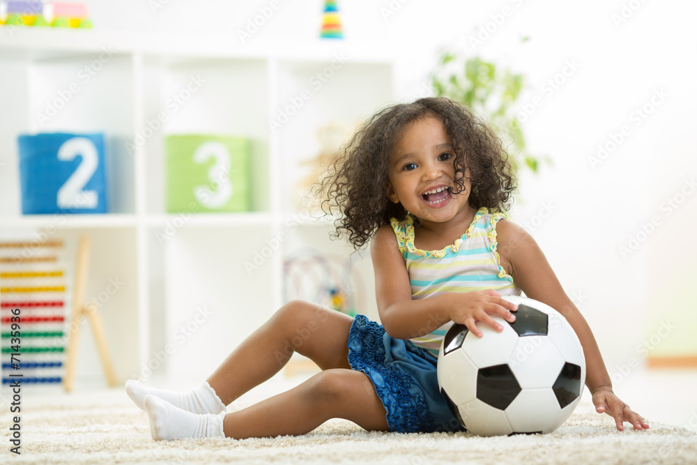 Kid girl playing toys at kindergarten room Kid girl playing toys at kindergarten room