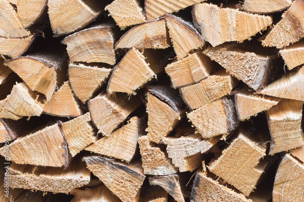 Stack of firewood - wooden abstract background Stack of firewood - wooden abstract background