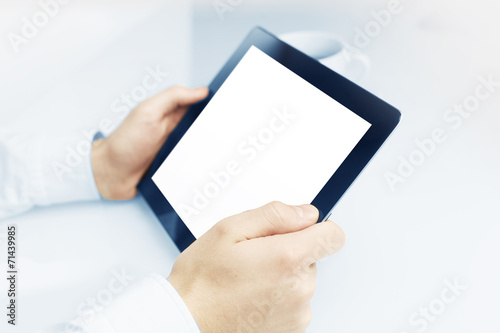 businessman holding tablet