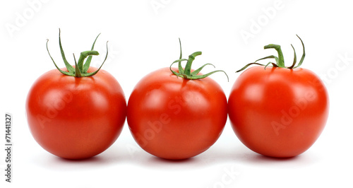 Three tomatoes isolated on white background