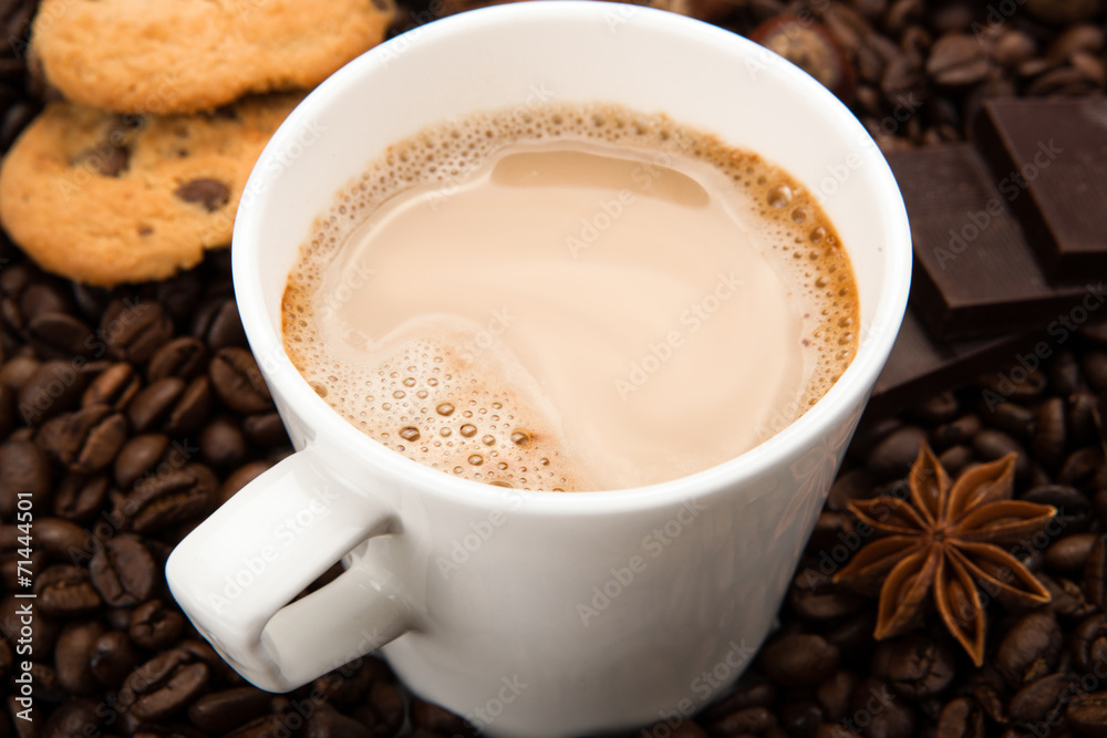 Fototapeta premium coffee beans coffee with cream in a cup