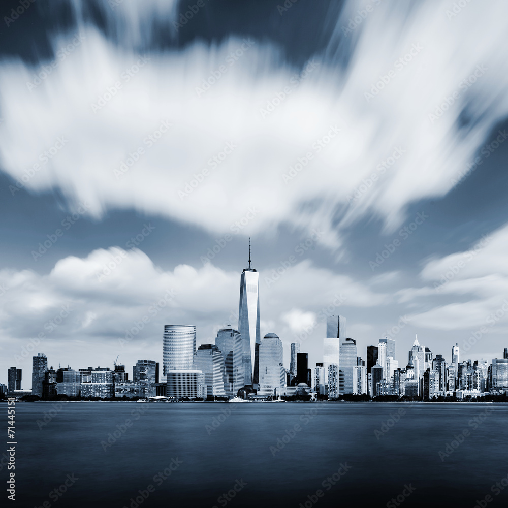 Obraz premium Modern Manhattan cityscape in blue color with blurred sky