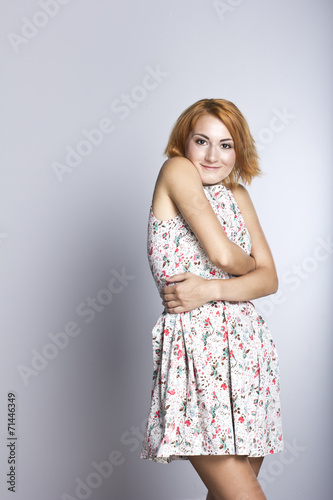 Beautiful slim young girl in a short dress