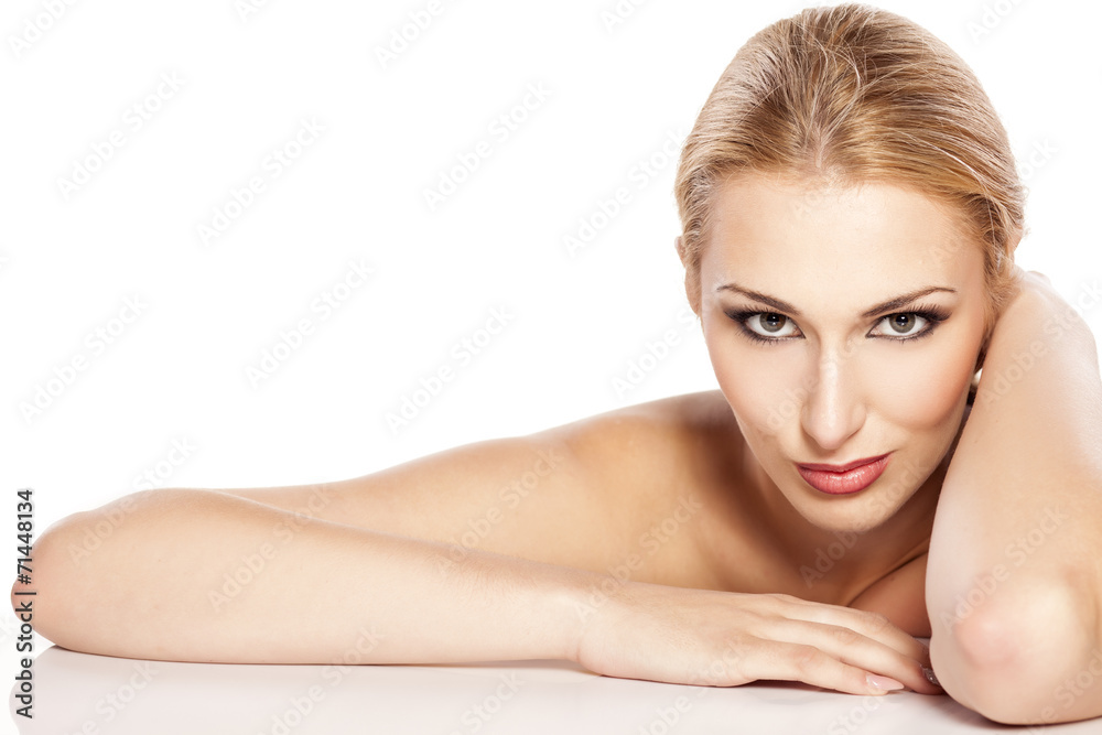 beautiful blonde with makeup lying on white beautiful blonde with makeup lying on white