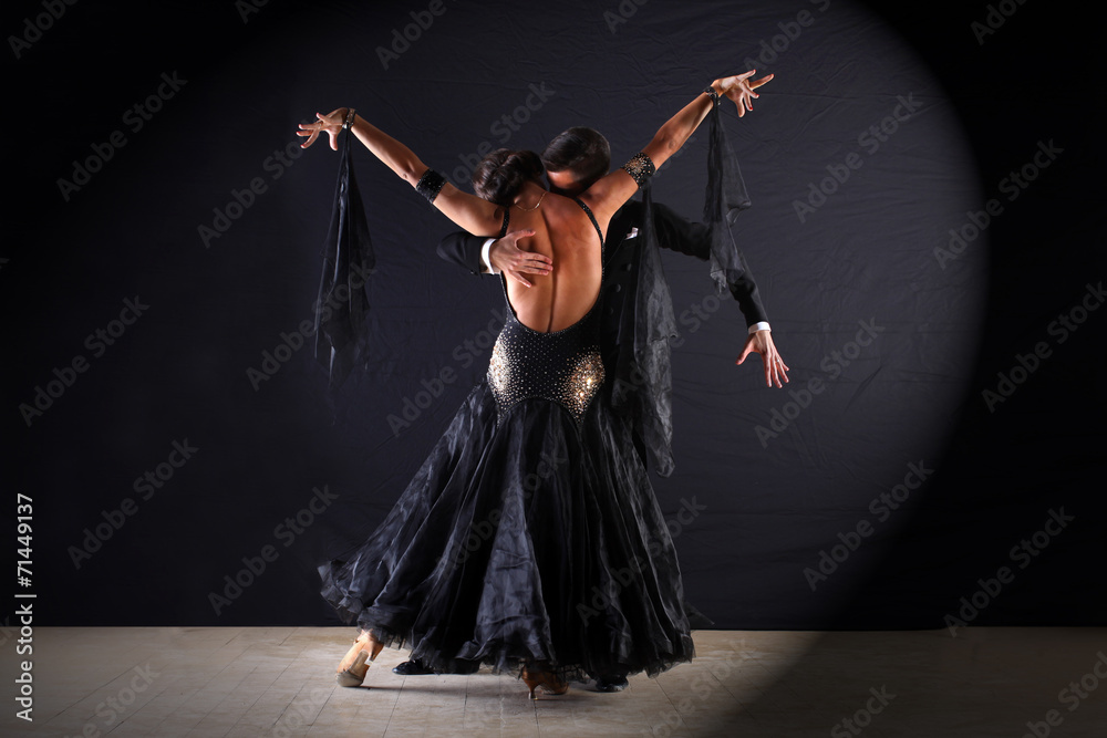 Latino dancers in ballroom isolated on black