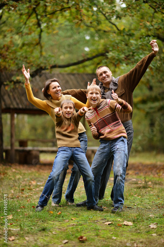 Family of four in autumn