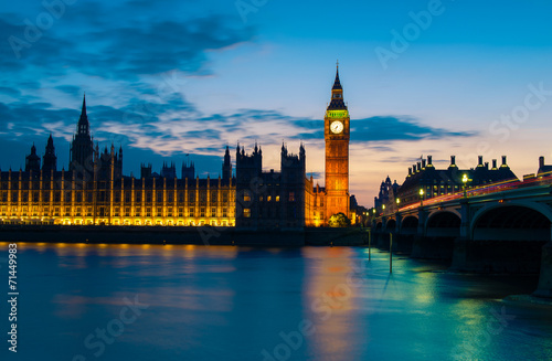 Big Ben and Westminster abbey at night in London, UK photo