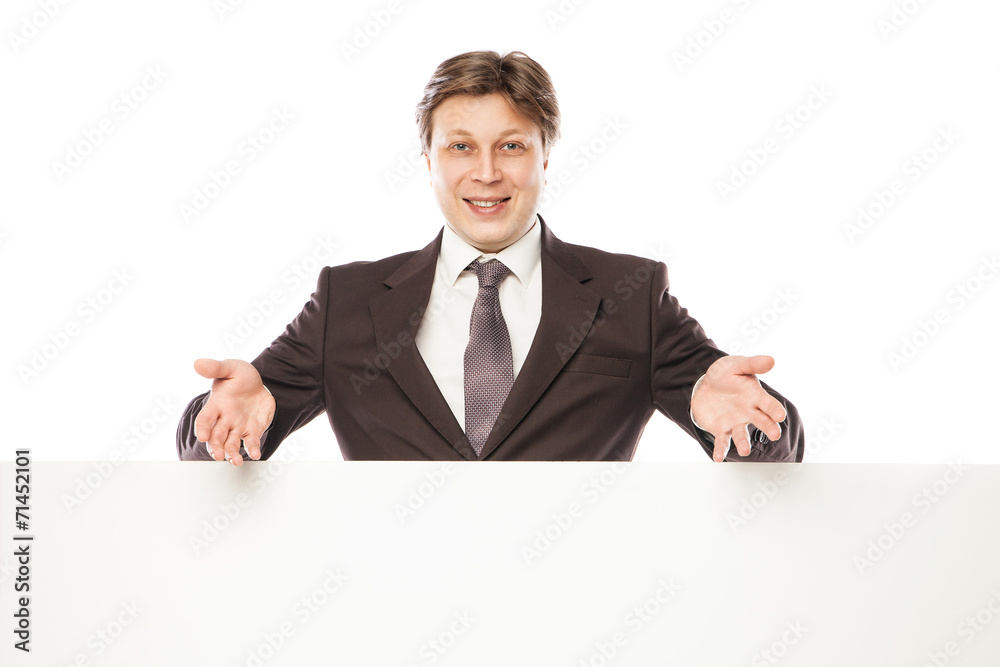 Business man holding empty board and pointing Business man holding empty board and pointing