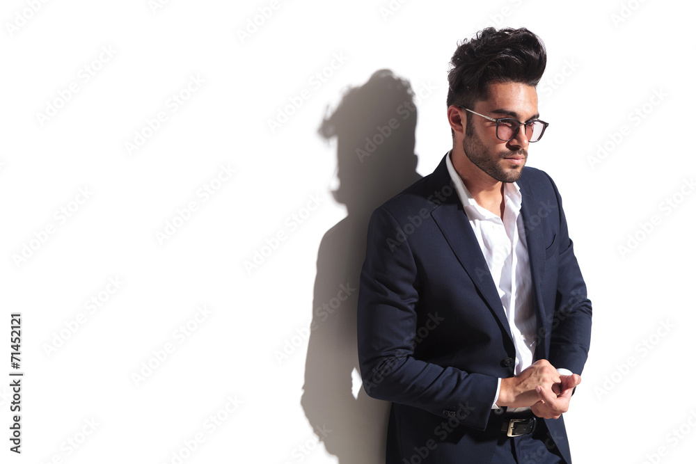 attractive business man holding his hands attractive business man holding his hands