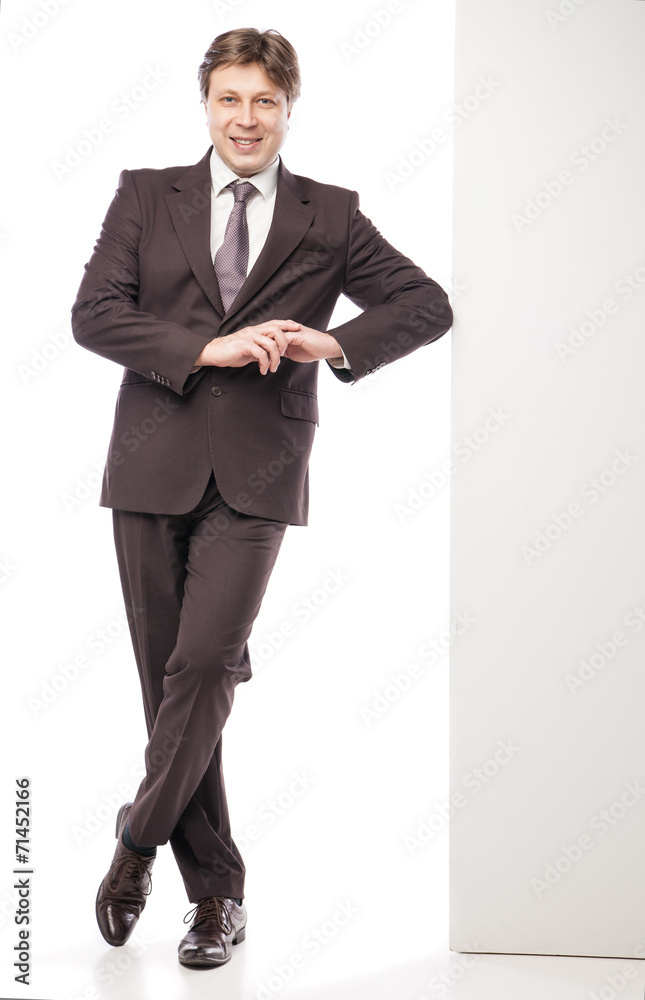 Man leaning against empty board isolated Man leaning against empty board isolated