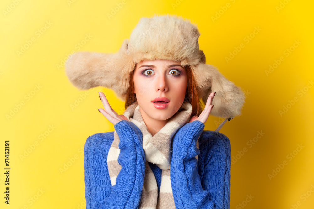 Redhead girl in hat on yellow background. Redhead girl in hat on yellow background.