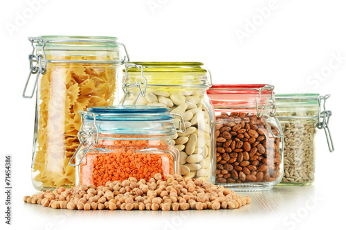 Jars with grain foods isolated on white