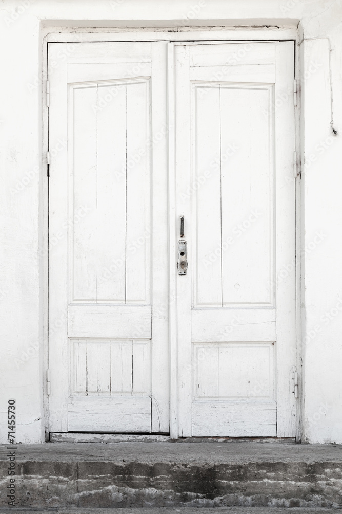 White wall and wooden door, background texture White wall and wooden door, background texture