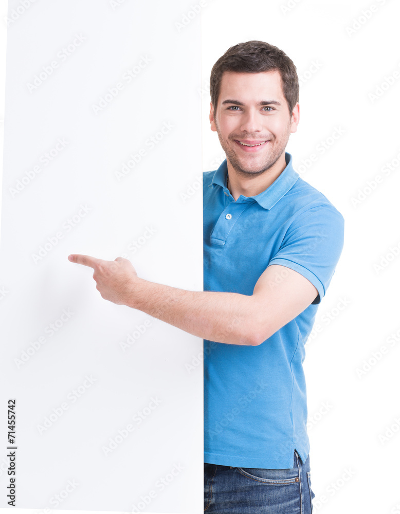 Happy man points finger on a blank banner. Happy man points finger on a blank banner.