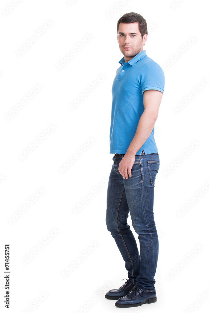 Full portrait of smiling happy handsome man in blue t-shirt. Full portrait of smiling happy handsome man in blue t-shirt.
