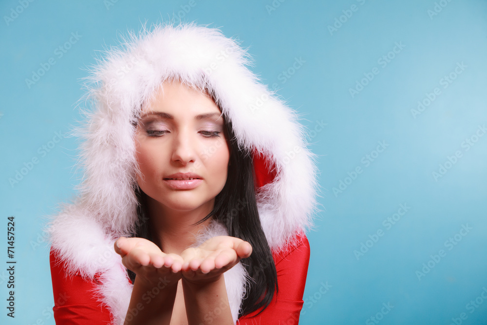 Portrait woman wearing santa clause costume on blue Portrait woman wearing santa clause costume on blue