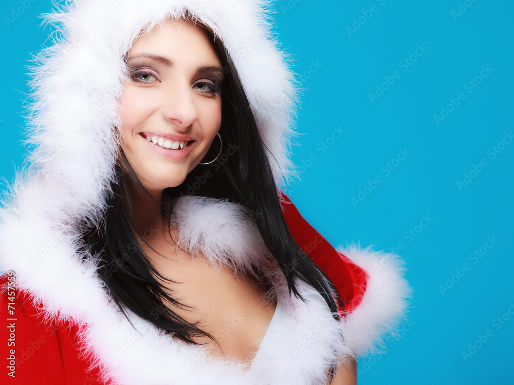 Portrait woman wearing santa clause costume on blue Portrait woman wearing santa clause costume on blue