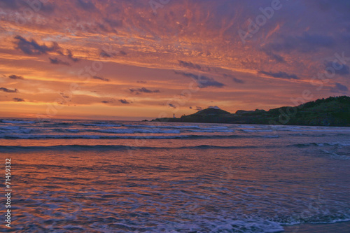 Red Sky Sunset and Lighthouse