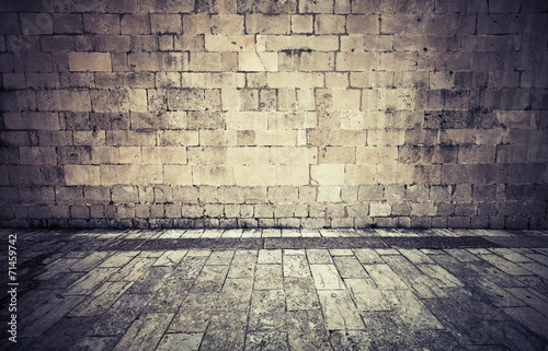 Stone wall and pavement of old town square. Instagram Effect