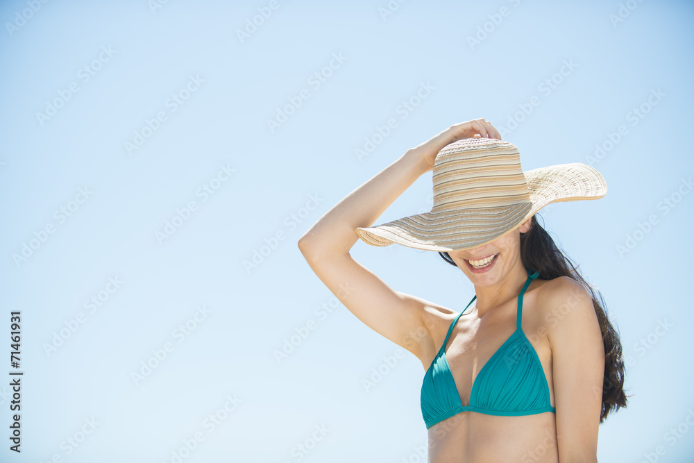portrait of a beautiful young woman in a swimsuit on the beach p
