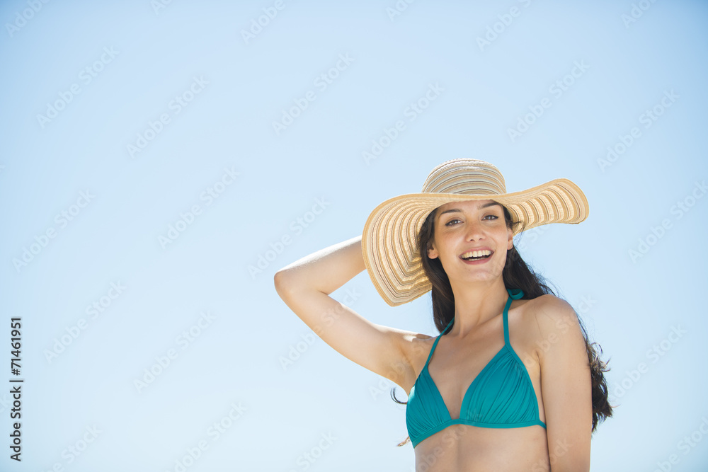 portrait of a beautiful young woman in a swimsuit on the beach p