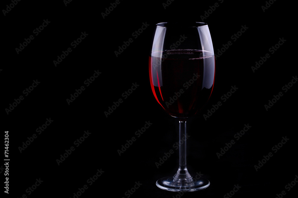 Red wine glass on the black background Stock Photo | Adobe Stock