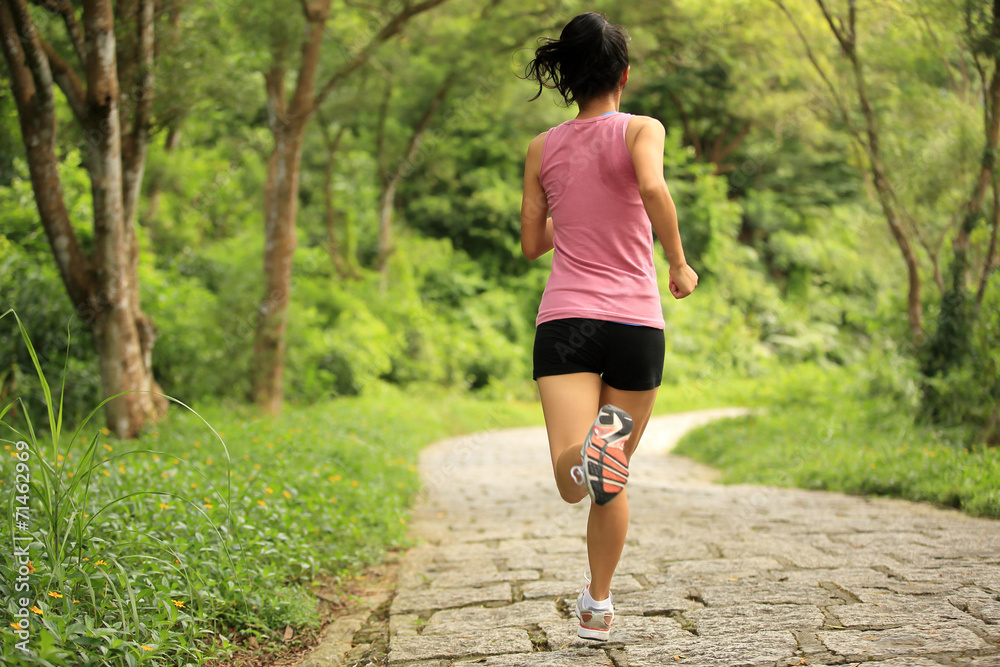 fitness woman runner running on trail