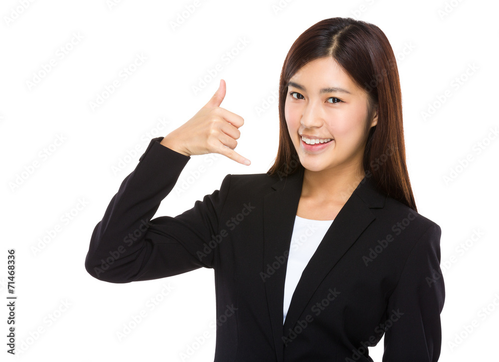 Businesswoman with call me gesture Businesswoman with call me gesture