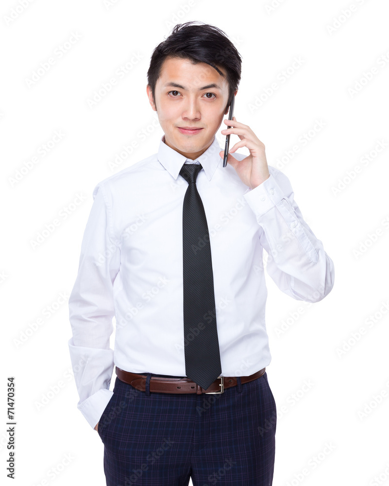 Businessman talk to mobile phone Businessman talk to mobile phone