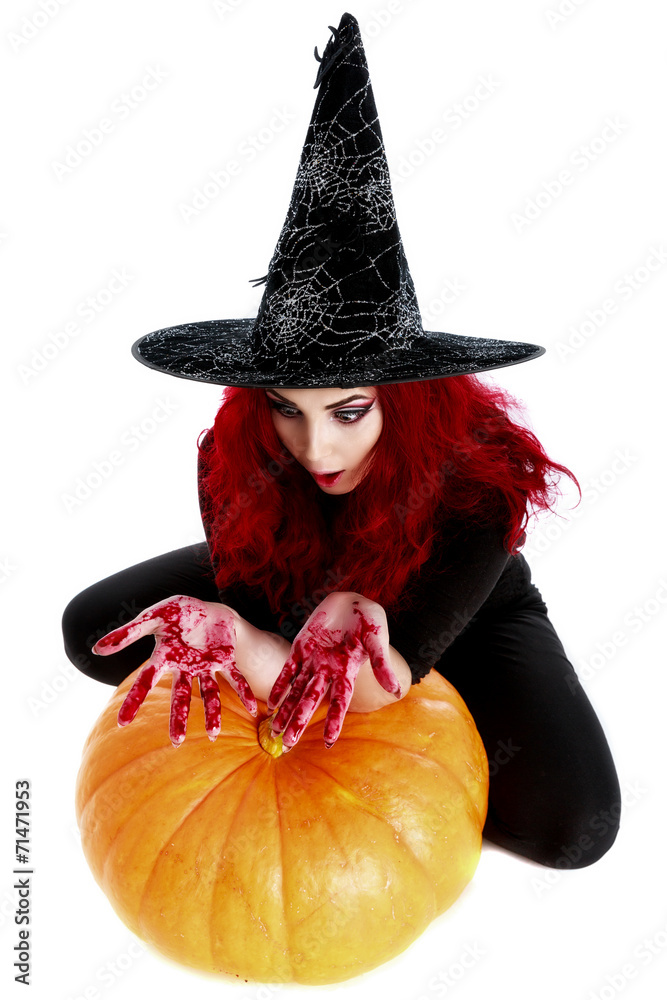 witch with bloodstained hands sits on a pumpkin witch with bloodstained hands sits on a pumpkin