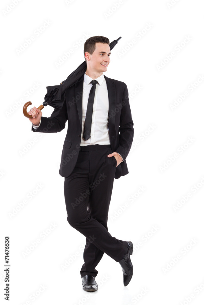 Relaxed elegance man posing with an umbrella Relaxed elegance man posing with an umbrella