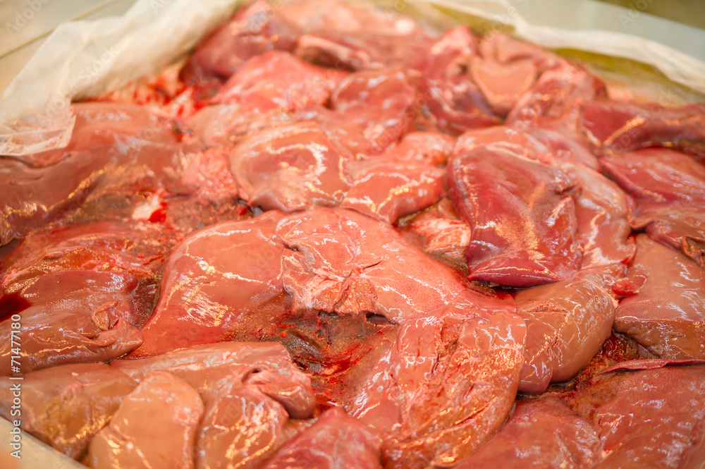 Fresh beef liver slices on table in supermarket Fresh beef liver slices on table in supermarket