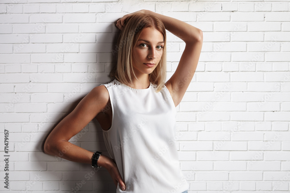 woman in a blank t-shirt. brick wall background woman in a blank t-shirt. brick wall background