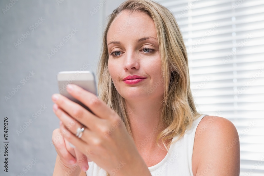 Beautiful businesswoman text messaging Beautiful businesswoman text messaging