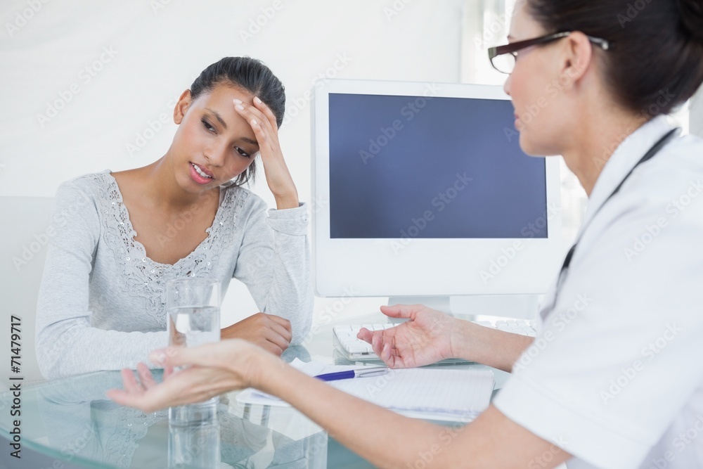 Doctor talking with upset looking patient Doctor talking with upset looking patient