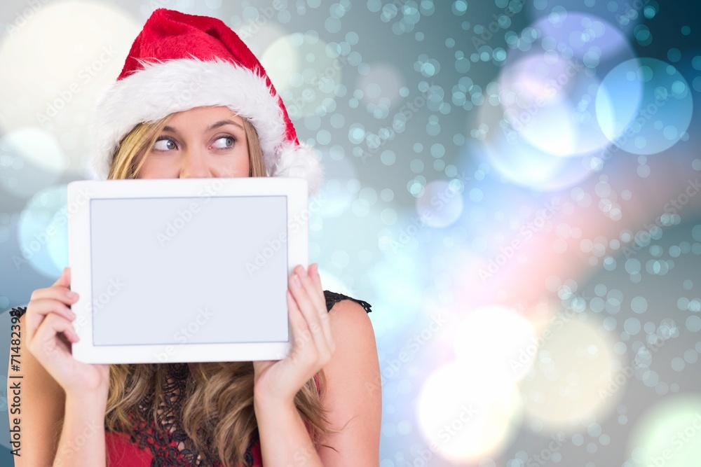 Composite image of festive blonde showing a tablet Composite image of festive blonde showing a tablet