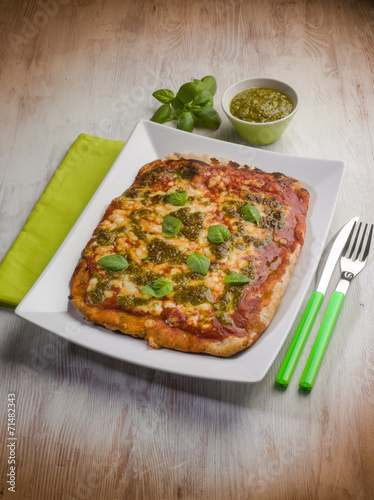 homemade pizza with pesto sauce