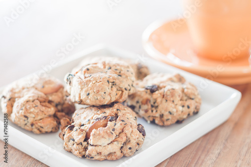 Closeup healthy cookies on white plate with coffee cup