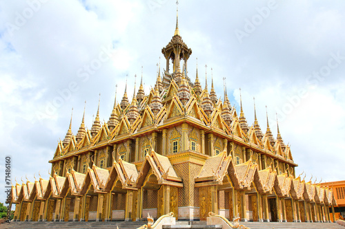 Golden pagoda at Wat Tha Sung Temple in Uthai Thani, Thailand. photo