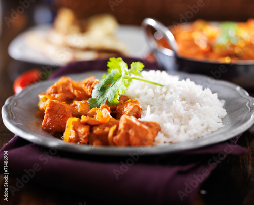 indian chicken vindaloo curry with basmati rice on plate