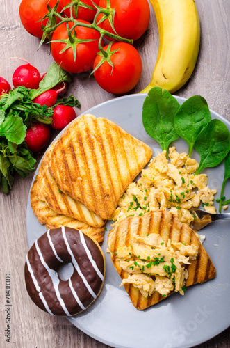 Healthy breakfast scrambled eggs with chive, panini toast