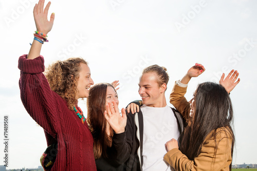 Group of young people at the waving