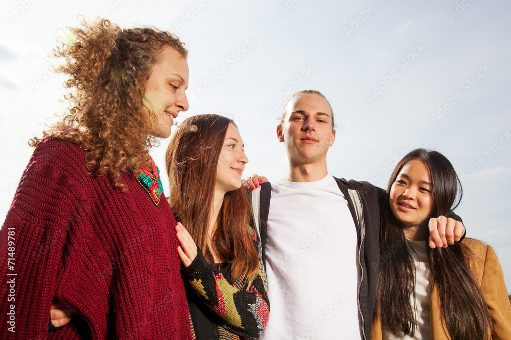 Group of young people outside in the park Group of young people outside in the park