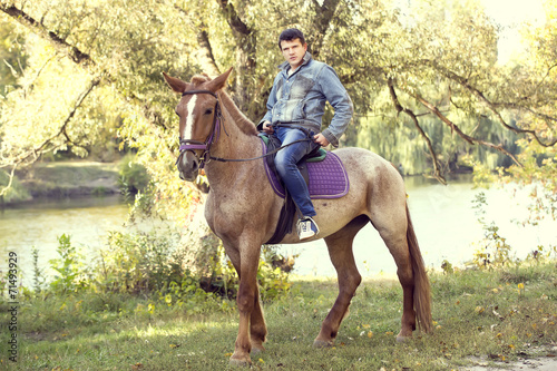 horse ride young guy autumn forest © lester120