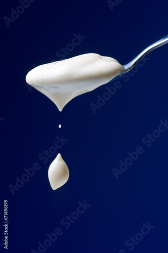 Spoon with yogurt